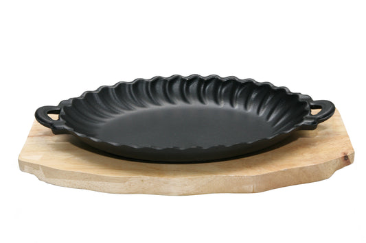 Cast iron serving bowl with wooden tray